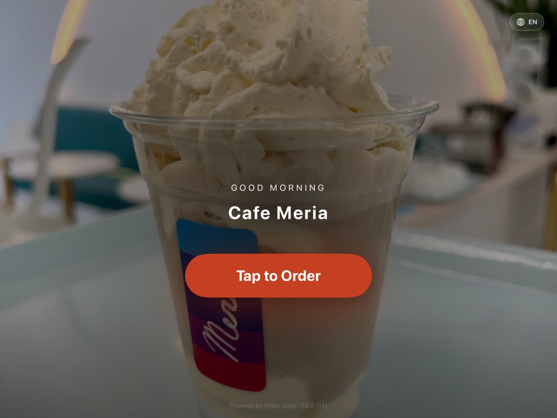 Order June running on a landscape iPad — the menu grid in the middle and the cart rail on the right