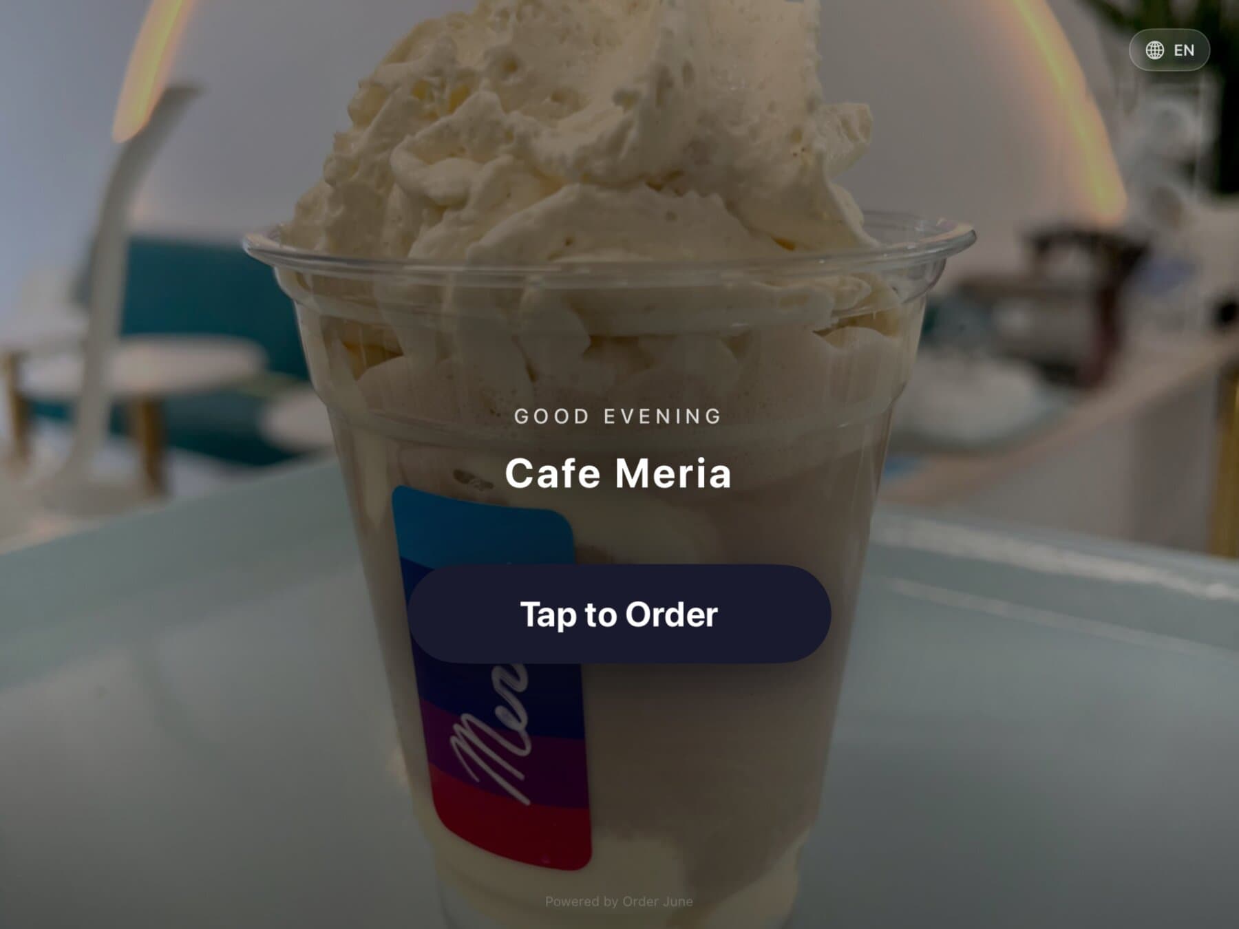 The menu view on Order June — grid of item tiles with photos, names, and prices, category sidebar on the left